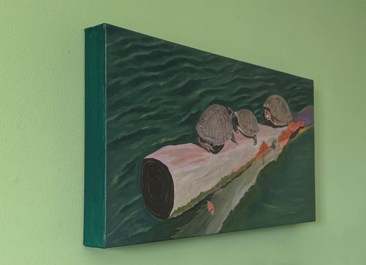 A photo of a side view of canvas depicting three turtles on a log above water