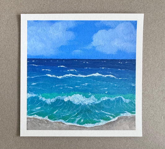 4.25in x 4.25in art print with white borders of a painting of a beach scene with blue ocean waves and sky
